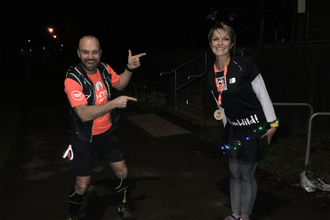 Dan pointing at Team Wild runner Fi at the Moonlit Meadow Run