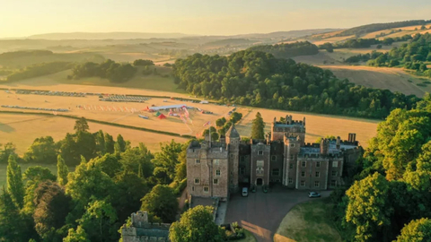 Sunset views over Dunster Castle with the SW Coast 50 event village in the background