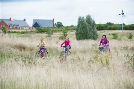 Cambourne housing with meadowland and wind turbine